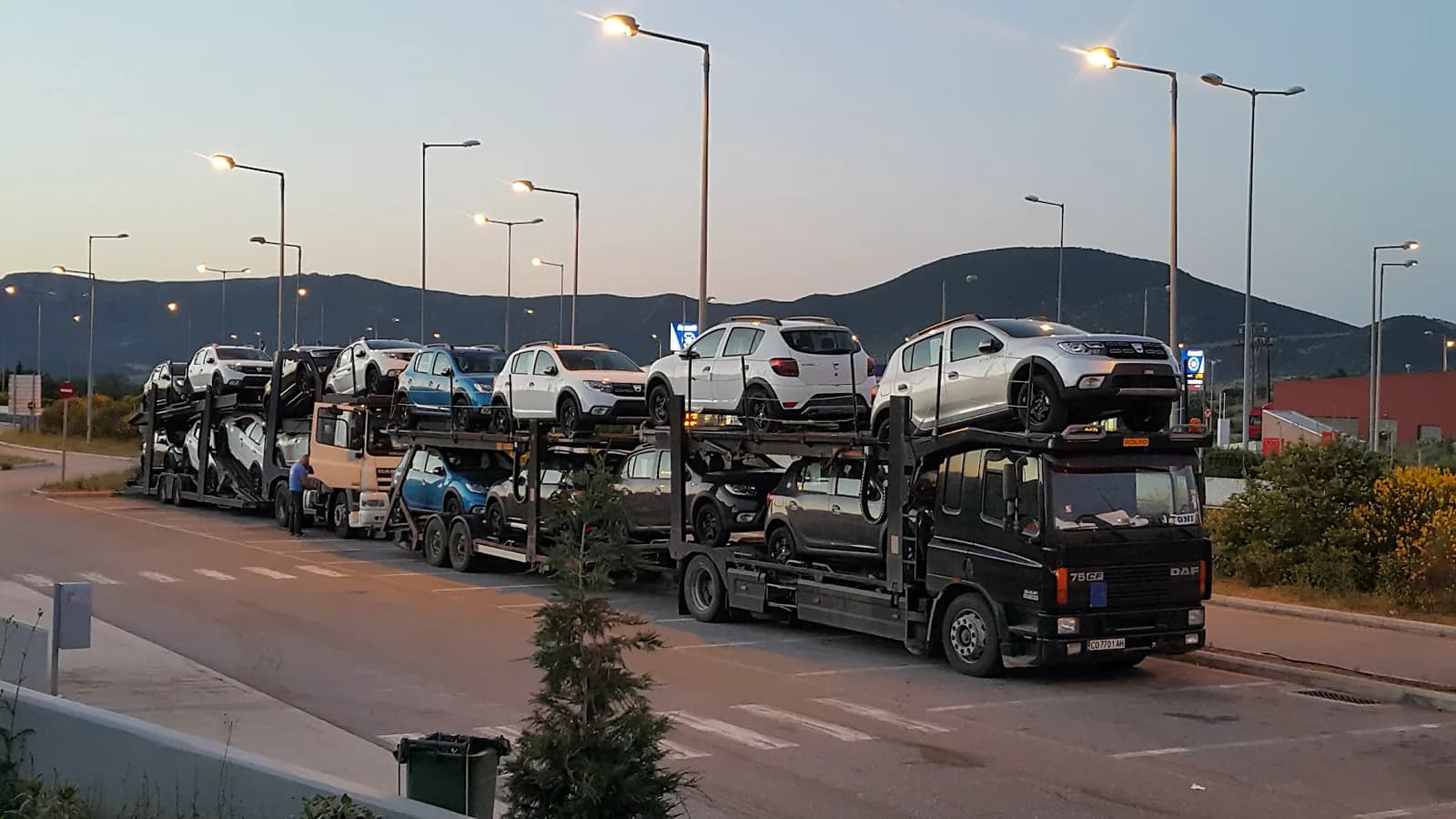 ILAN Transport car carriers loaded with new vehicles at dusk